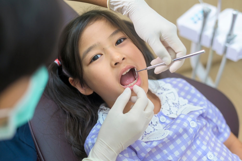 when should you start flossing your child’s teeth?